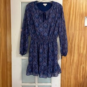 Long sleeved dress- sheer material with cover underneath.